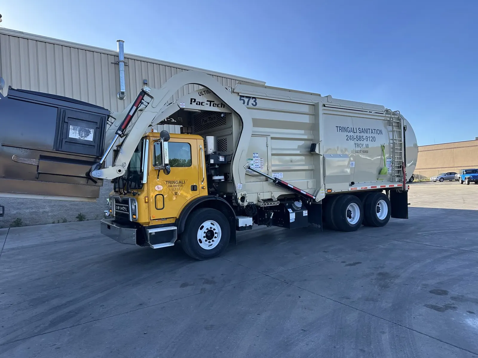 Tringali Sanitation side-loader truck